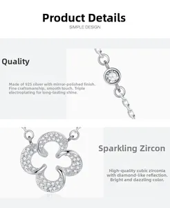 Detailed macro view of 925 silver four-leaf clover pendant with cubic zirconia stones