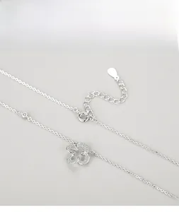 Detail of s925 silver four-leaf clover pendant with zircon inlay and lobster clasp