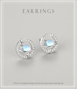 Detailed view of s925 silver planet stud earrings with moonstone and pavé zircons