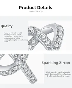 Macro detail of S925 sterling silver cross earrings with high-quality cubic zirconia stones
