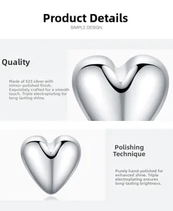 Macro detail of S925 sterling silver heart earrings with high polished mirror finish surface