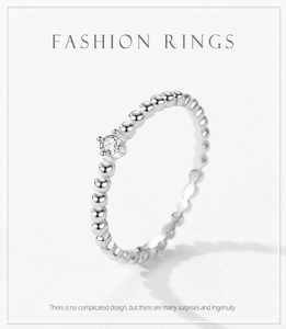 Detail shot of s925 silver beaded band ring with a sparkling micro-set cubic zirconia