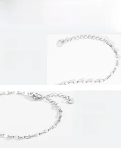 Macro detail of 925 sterling silver chain featuring lobster clasp and S925 engraved tag