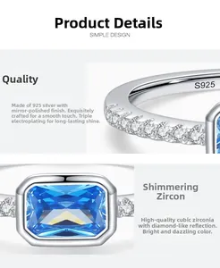 Macro detail of S925 silver ring featuring blue emerald-cut cubic zirconia and side stones