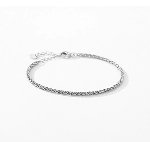 Detailed view of s925 silver wheat chain bracelet with lobster clasp and round charm tag