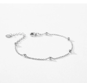 Detail of 925 sterling silver beaded bracelet showing lobster clasp and S925 hallmark tag
