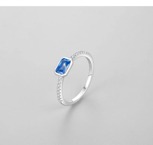 Close-up of S925 sterling silver ring with rectangular blue zircon and micro-pave diamonds