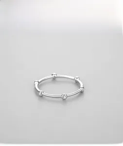 Detailed view of s925 silver minimalist stackable ring with sparkling zircon stones