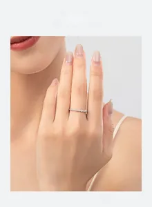 Close-up of minimalist 925 sterling silver ring with micro-pave zirconia on a hand