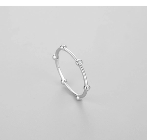 Close-up of polished S925 sterling silver minimalist ring with sparkling cubic zirconia