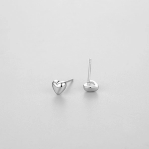 Polished S925 sterling silver heart stud earrings with minimalist aesthetic for women