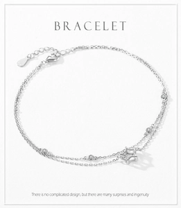 Detail of double-layer S925 sterling silver star bracelet with zircons and lobster clasp