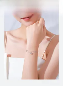 Detailed view of s925 silver double-layer star bracelet with micro-pave zircon on wrist