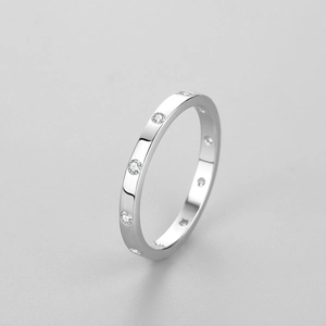 Minimalist s925 silver geometric ring with cubic zirconia stones on grey background