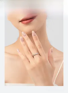 Close-up of minimalist S925 silver criss-cross geometric ring with small zircon stones