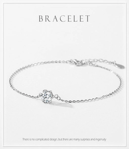 Detail of s925 silver six-prong single diamond bracelet with lobster clasp and chain