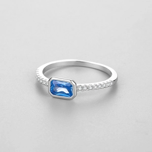 S925 sterling silver ring featuring a radiant emerald-cut blue zircon with side diamonds