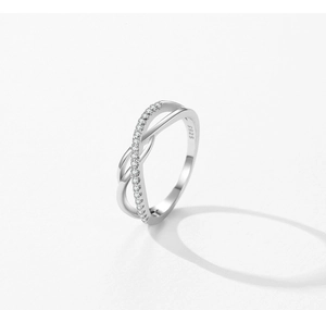 Close-up of S925 silver cross ring showing pavé zircons and material hallmark