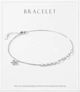Close-up of S925 sterling silver bow bracelet with polished sequins and adjustable chain