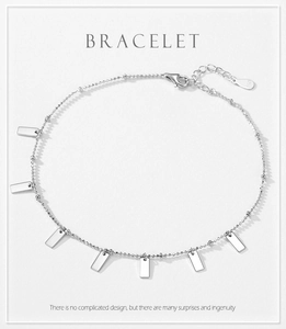 Detailed view of S925 sterling silver beaded bracelet with polished rectangular charms
