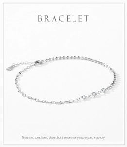 Close-up of S925 sterling silver bracelet with clover charms and cubic zirconia stones