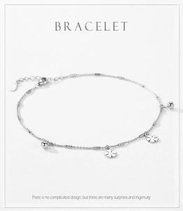 Detail of s925 silver bracelet with hollow clover pendants and lobster clasp
