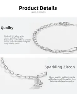 Detail of S925 silver bracelet featuring a zircon-studded butterfly and star charms