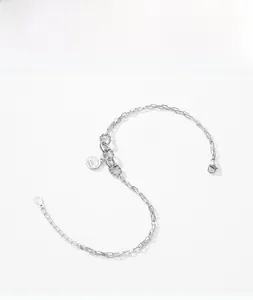 Detail of S925 sterling silver geometric link bracelet with engraved charm and lobster clasp