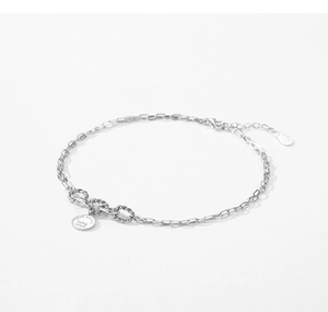 Macro shot of S925 sterling silver chain with engraved Love always being afloat charm