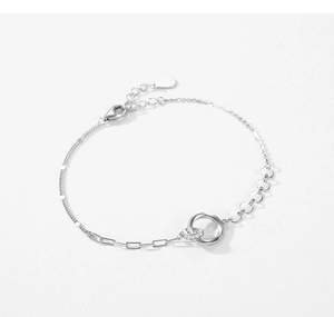 Detail view of S925 silver bracelet featuring double interlocking rings with cubic zirconia