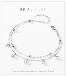 Detailed view of S925 silver double-layer bracelet with square pendant and lobster clasp