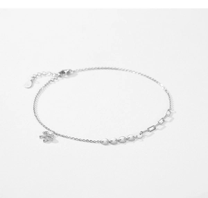 Macro shot of S925 sterling silver chain featuring bow pendant and polished sequins