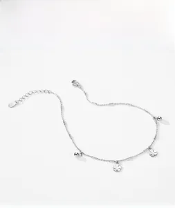 Detail shot of S925 sterling silver clover charms and round beads on adjustable bracelet