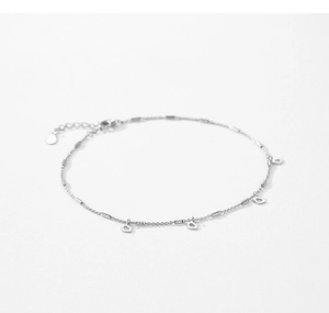 Macro detail of silver link chain featuring four delicate hollow heart charms and clasp