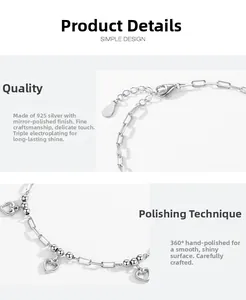Detailed macro view of 925 sterling silver heart charm and lobster clasp chain