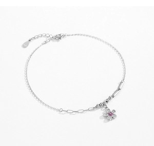 Macro detail of S925 sterling silver flower bracelet with pink zircon stone and adjustable clasp