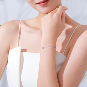 925 sterling silver minimalist lip-link bracelet with hollow heart charms on wrist