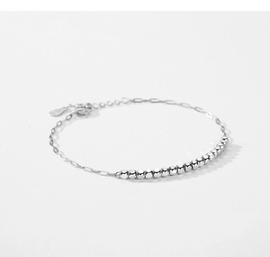 Detailed close-up of s925 sterling silver chain bracelet with bead and paperclip links