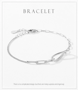 Macro shot of silver infinity bracelet with asymmetrical chain and lobster clasp