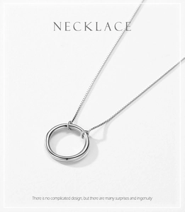 Close-up of a s925 silver necklace with a polished round hollow pendant and box chain