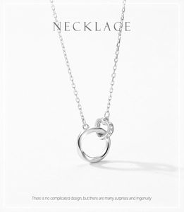 Detailed view of S925 silver heart lock necklace with pavé zircon interlocking rings
