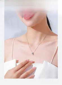 Model wearing a minimalist S925 sterling silver heart pendant necklace on a cable chain