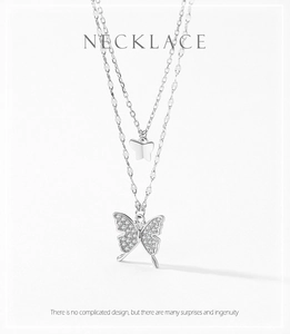 Detail of S925 silver double-layered butterfly necklace with shimmering zircon stones