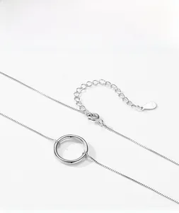 Macro shot of S925 sterling silver hollow round pendant and fine box chain necklace