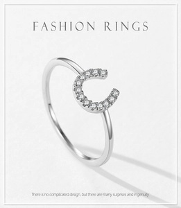 Close-up of S925 sterling silver U-shaped ring with micro-pave cubic zirconia crystals