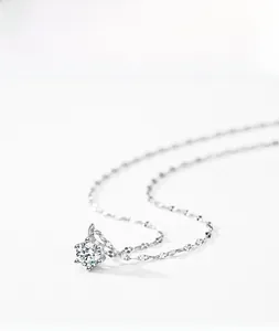 Macro shot of s925 silver necklace with a brilliant six-prong set cubic zirconia stone