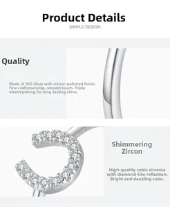 Detail of S925 sterling silver U-shaped ring with pavé cubic zirconia and mirror finish