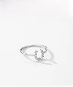 Macro shot of S925 sterling silver U-shaped ring with pavé-set white zircon horseshoe detail