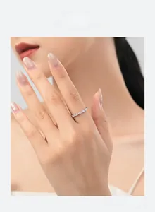 Close-up of minimalist S925 sterling silver ring with delicate pavé set cubic zirconia