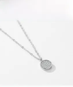 Detailed view of S925 sterling silver round pendant necklace with sparkling pavé zircons